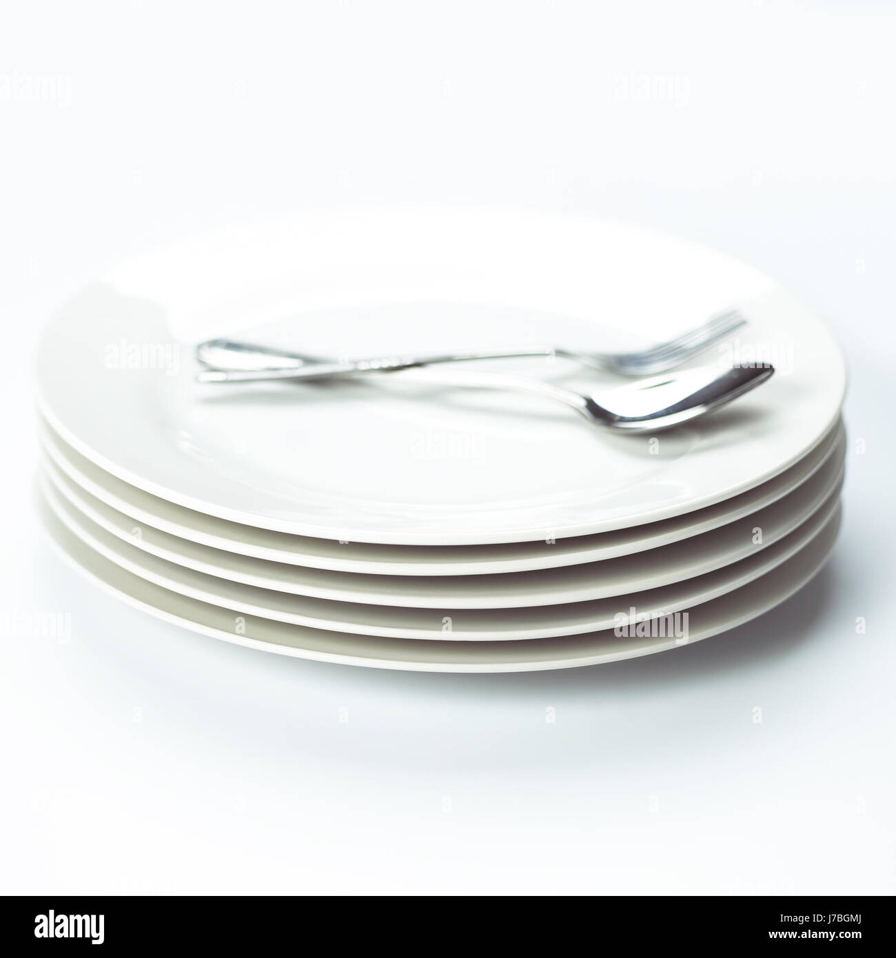 Piattino cina forcella dello stack di ceramica piastre bianche cucchiaio macro close-up macro Foto Stock
