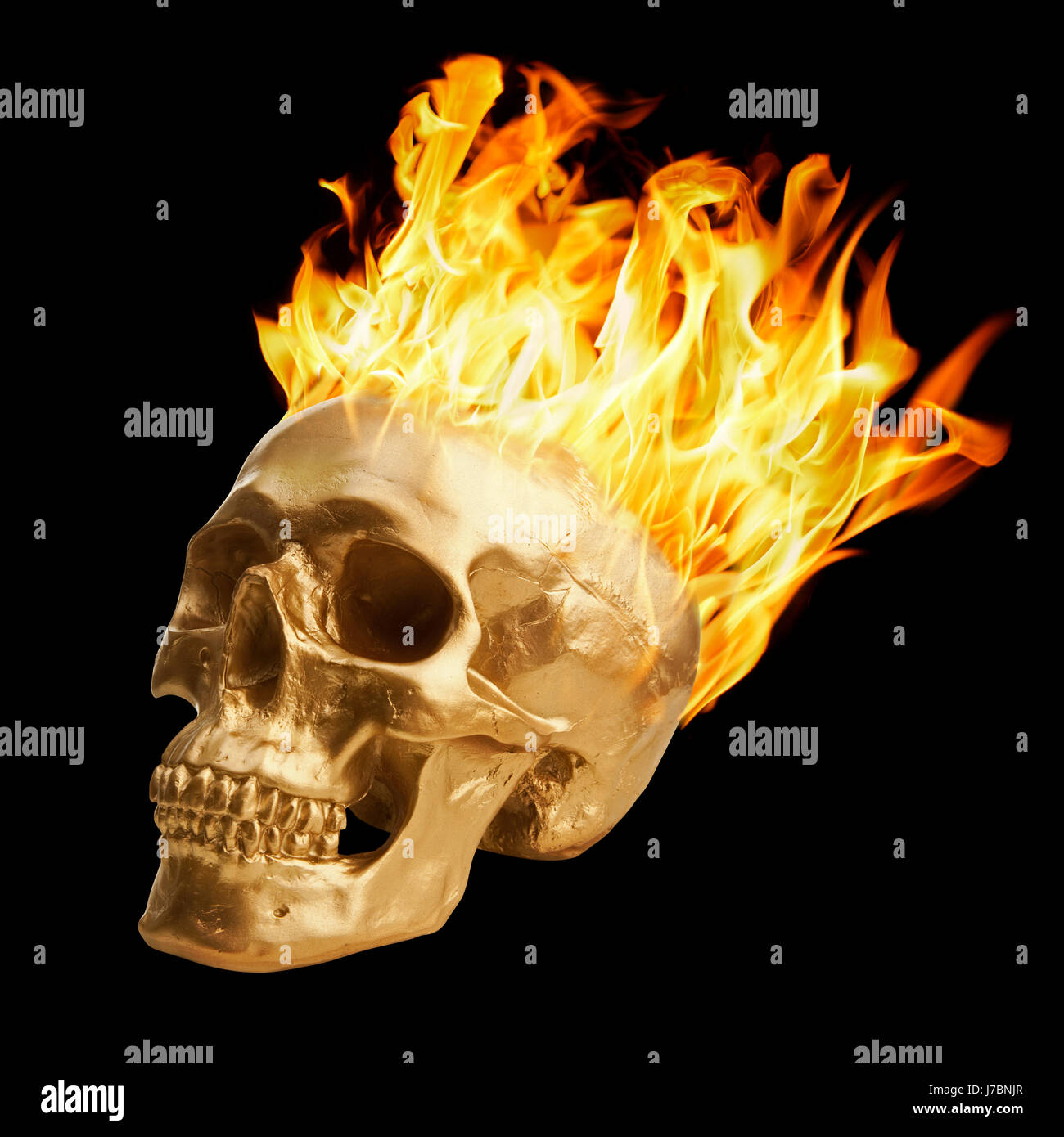 Golden skull fire conflagrazione fiamme fiamma bruciare bruciare oro oggetto di pericolo Foto Stock