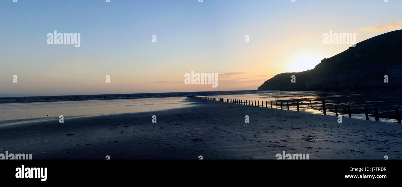 Brean giù al tramonto sulla spiaggia Foto Stock