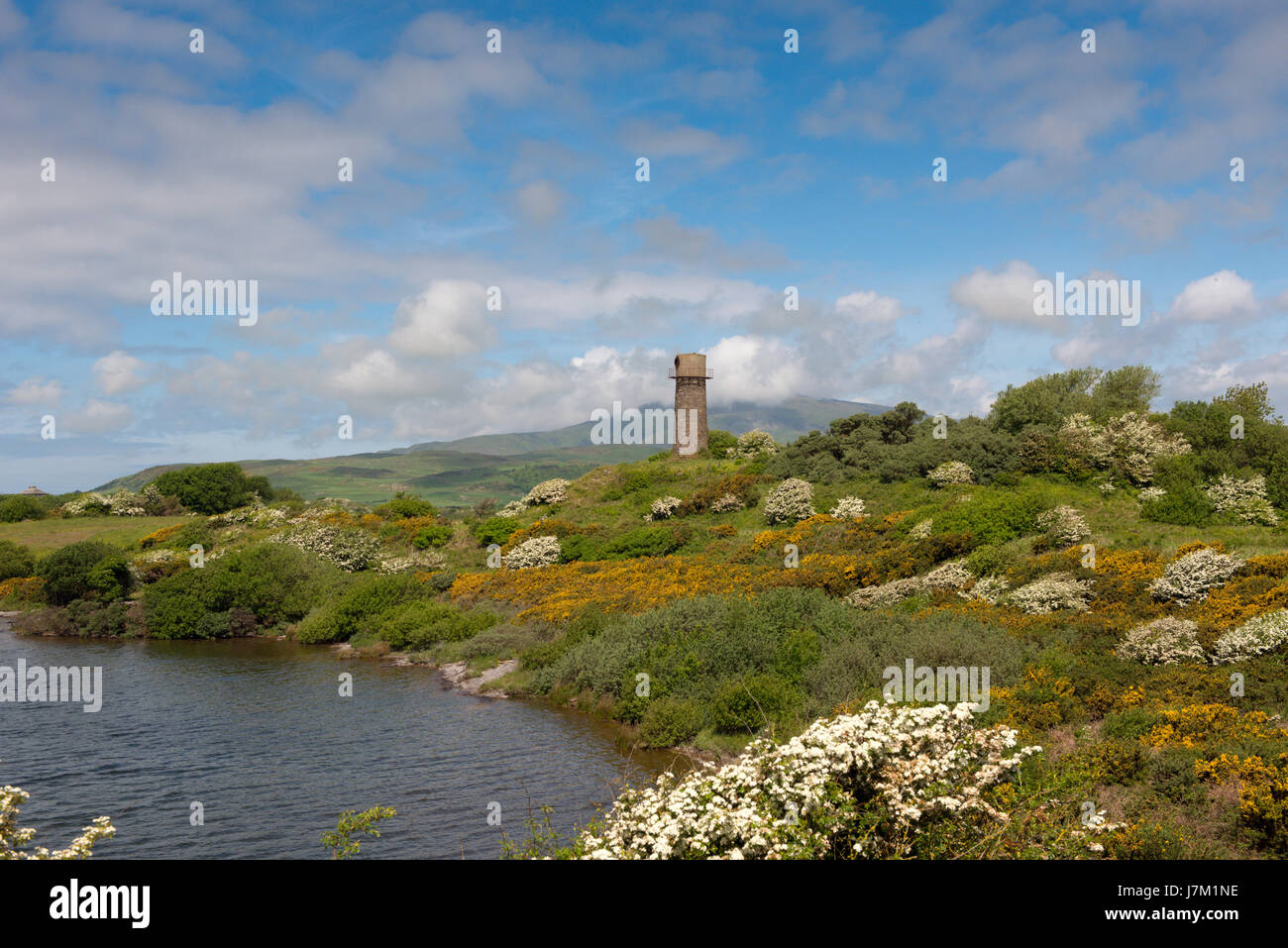 La vecchia pietra costruito il faro sulla Hodbarrow riserva naturale vicino a Millom in Cumbria Foto Stock