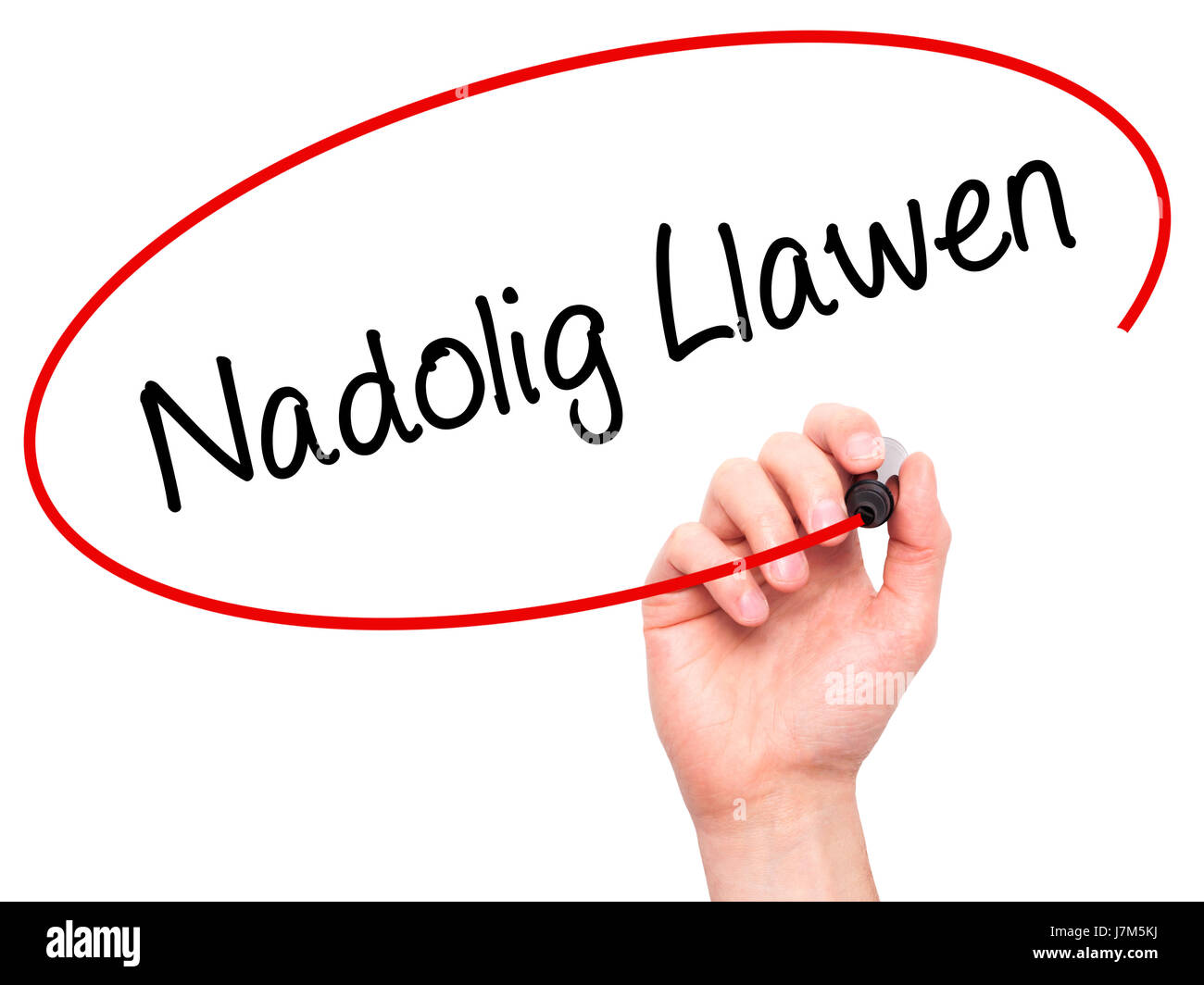 Man mano che scrive Nadolig Llawen (Buon Natale in lingua gallese) con pennarello nero su schermo visivo. Isolato su sfondo. Business, tecnologia internet Foto Stock