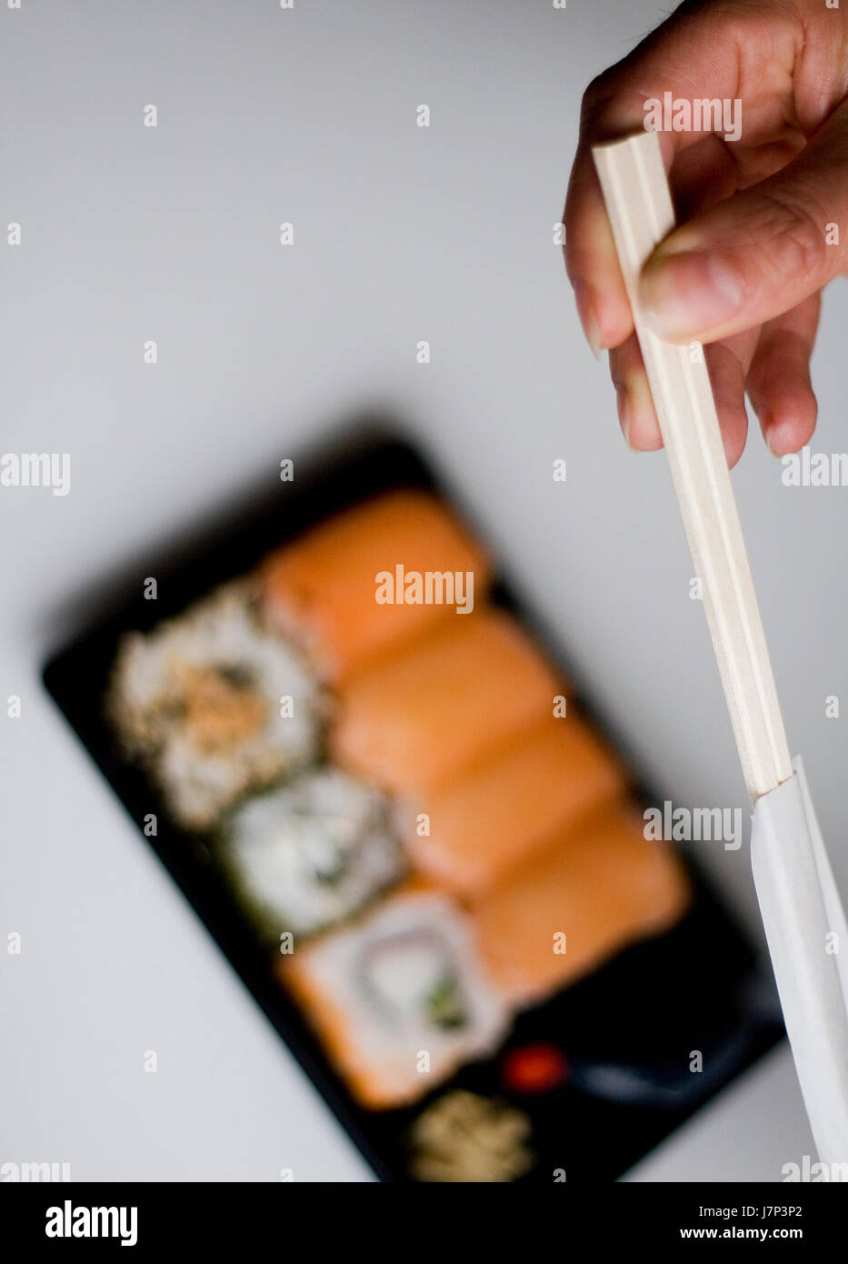 Asia fame pesce sushi giappone stick mangiare mangiare mangia la mano asia fame pranzo di pesce Foto Stock