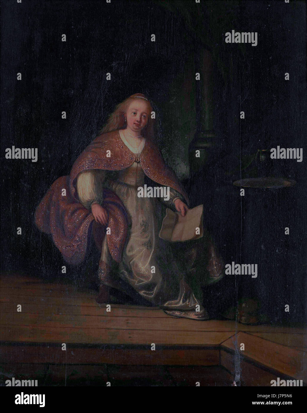 "Bathsheba con la lettera di Davide" è un famoso dipinto di Rembrandt, che raffigura la storia biblica di Bathsheba che riceve una lettera da re Davide. Il lavoro mette in mostra l'uso sapiente di luce e ombra di Rembrandt, nonché la sua capacità di catturare la profondità emotiva. Il dipinto è considerato un esempio significativo di arte barocca e mette in evidenza temi di amore, tentazione e conseguenze morali. Foto Stock