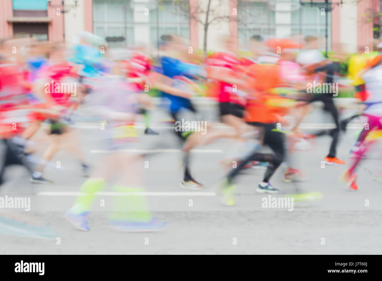 Abstract sfondo colorato di un gruppo di atleti in esecuzione su street, city marathon, effetto di sfocatura, irriconoscibili volti. Sport e fitness e uno stile di vita sano concetto. Foto Stock
