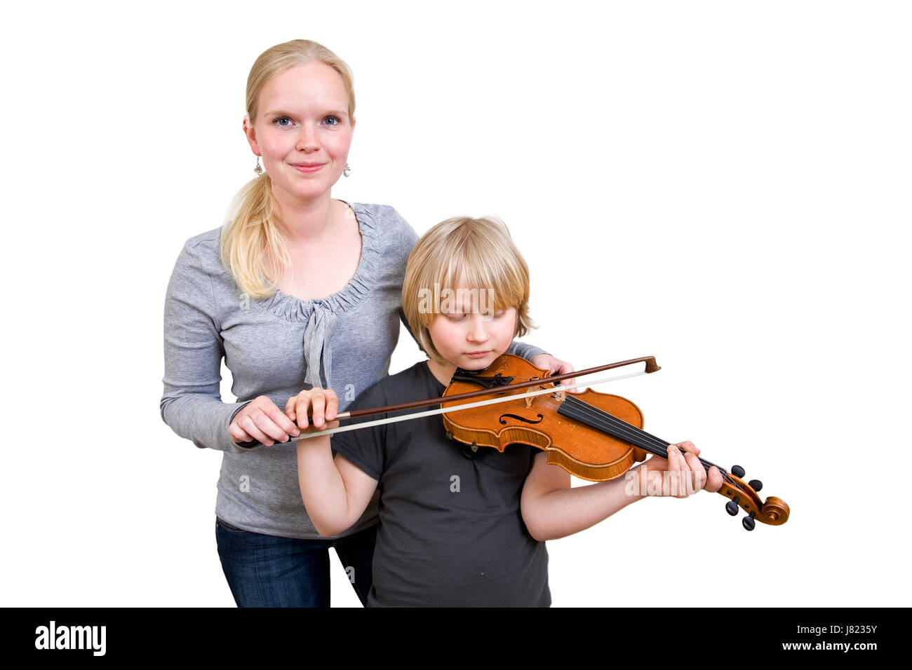 Donna imparare la musica del violino strumento di misura metodo donna  bambino ridere risate Foto stock - Alamy