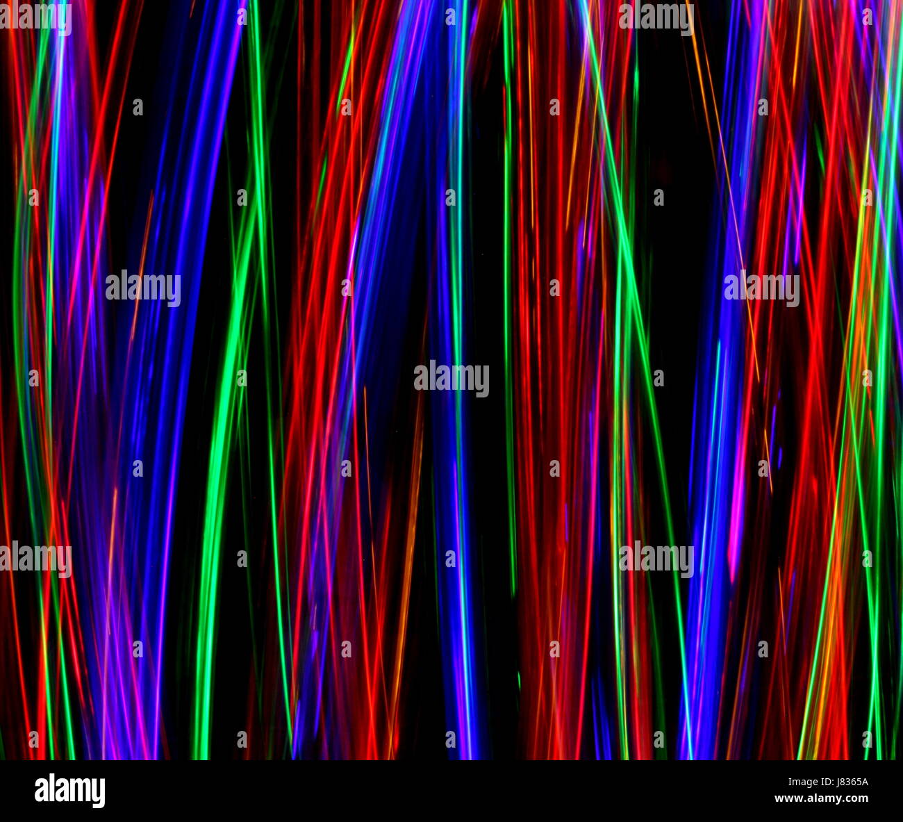 Multi luce colorata fotografia pittura, volute e loop contro uno sfondo nero Foto Stock