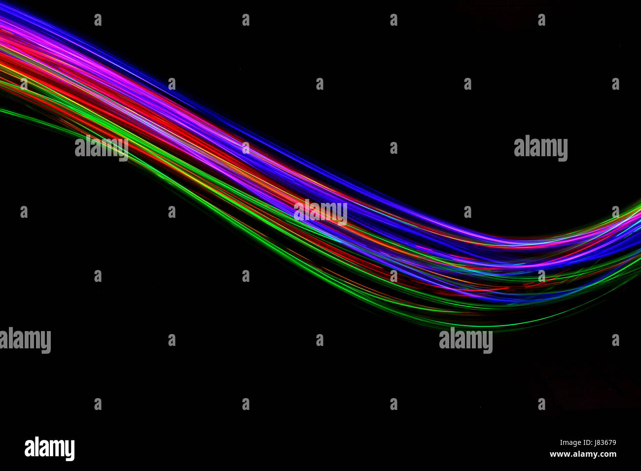 Multi luce colorata fotografia pittura, swirl e curva contro uno sfondo nero Foto Stock
