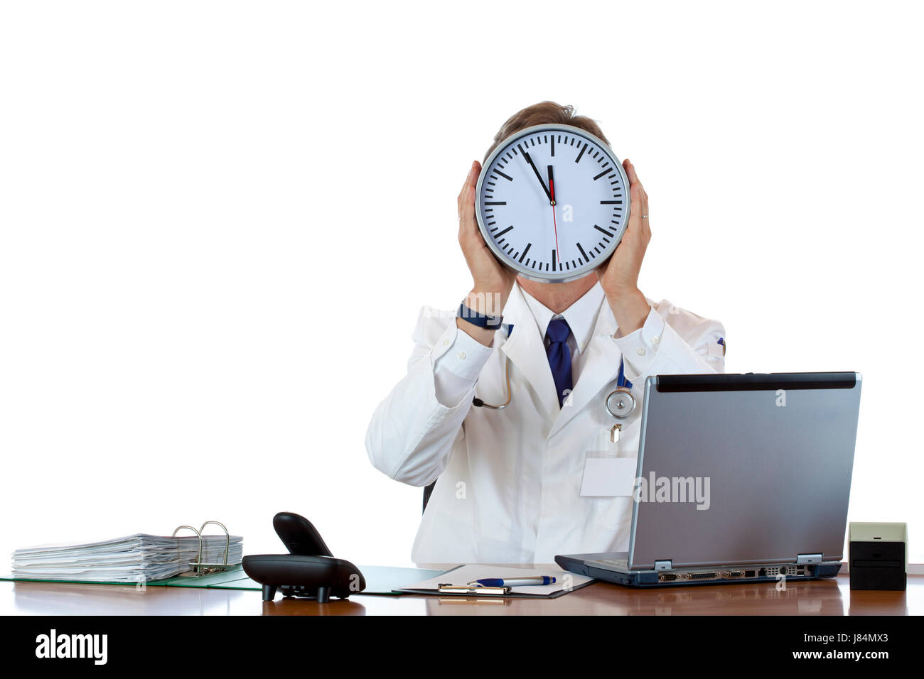 Medico orologio tiene di fronte faccia come segno di pressione in termini di tempo. Foto Stock