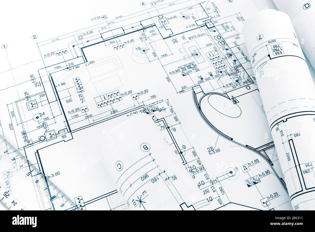 Disegni di progettazione blueprint e piano casa blueprint arrotolati Foto Stock