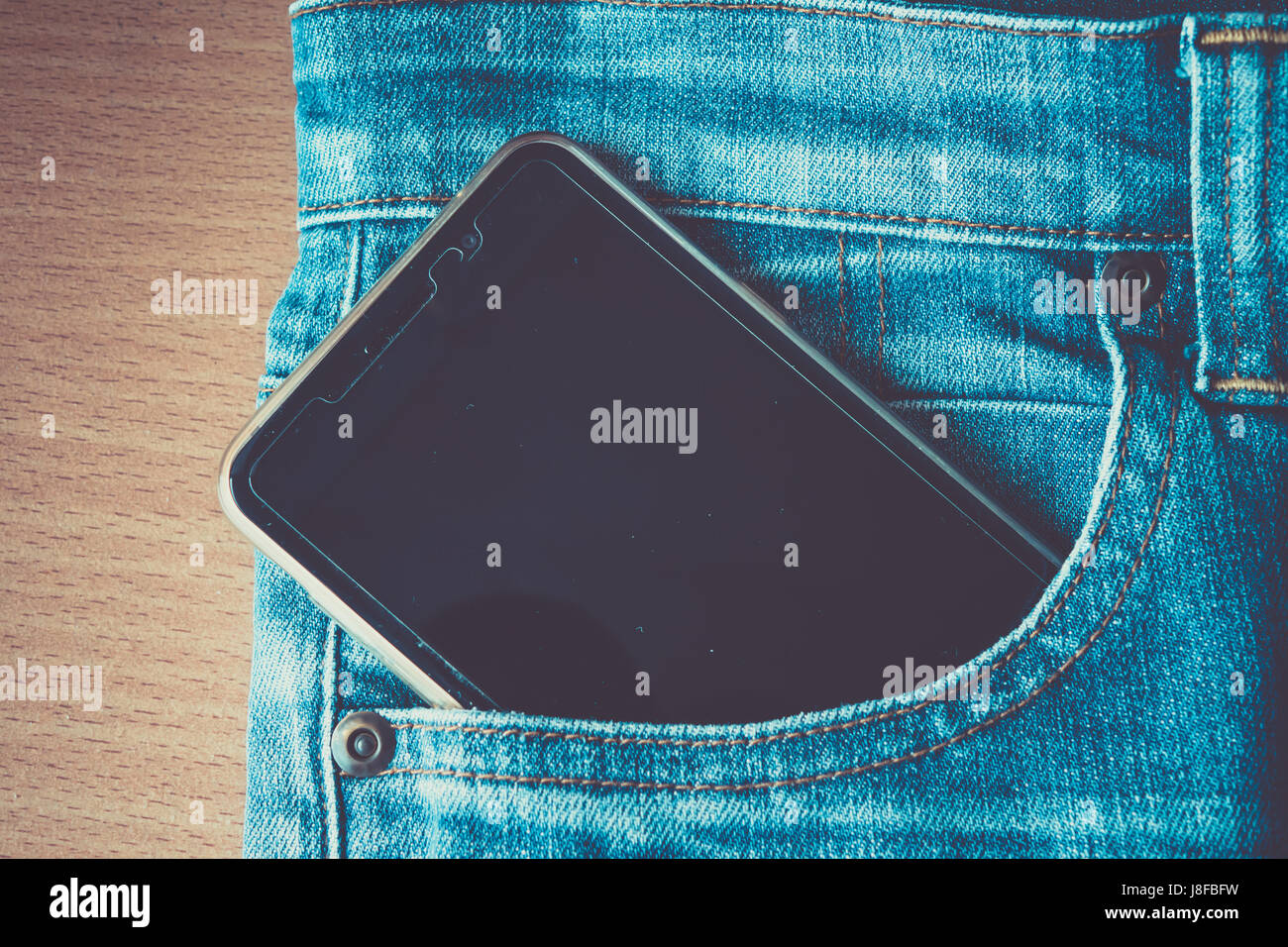 Jeans blu tasca, mettere il telefono Foto Stock