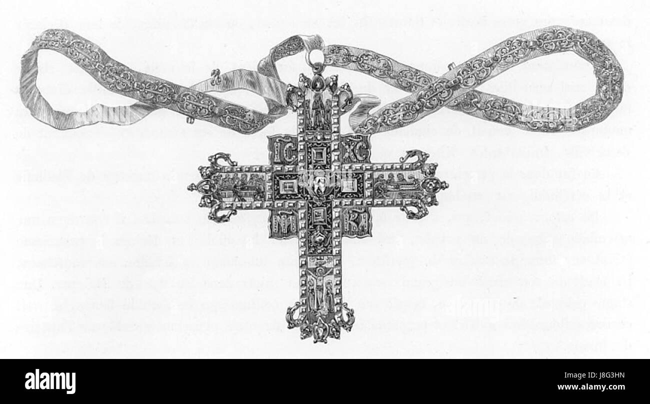 Una croce russa dorata, tipicamente usata nelle cerimonie religiose, adornata con disegni intricati. La croce è un simbolo del cristianesimo ortodosso russo ed è caratterizzata da un'elaborata lavorazione artigianale. Foto Stock