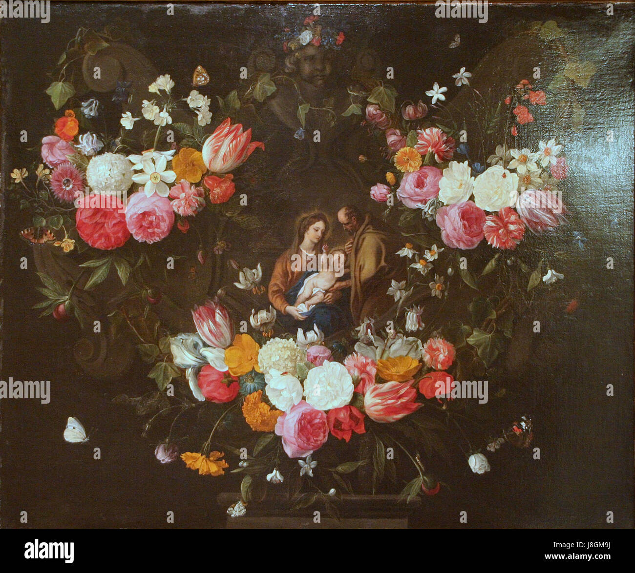 Jan van Kessel (I) Guirlande de fleurs avec la Sainte Famille Foto Stock