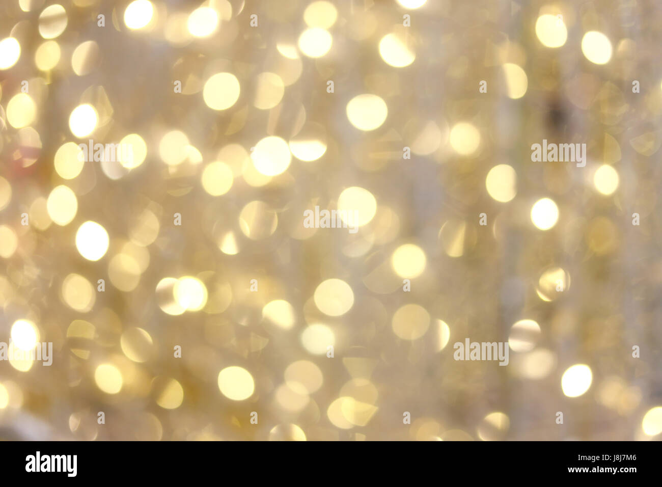 Fondo oro bokeh di luci di Natale per la progettazione sullo sfondo delle vostre opere. Foto Stock