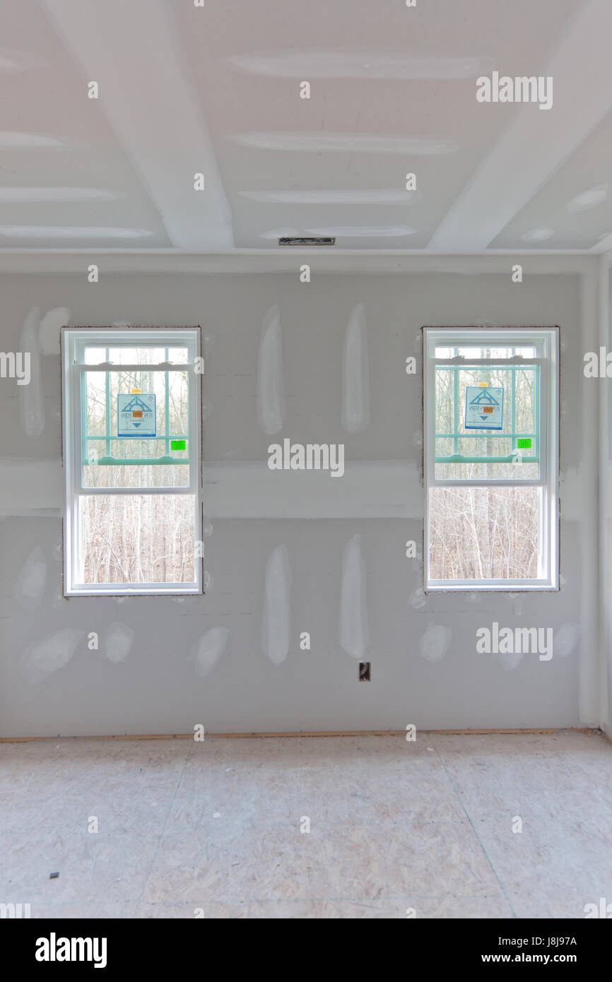 Nuova casa in costruzione - la sheetrock è alto e mudded Foto Stock