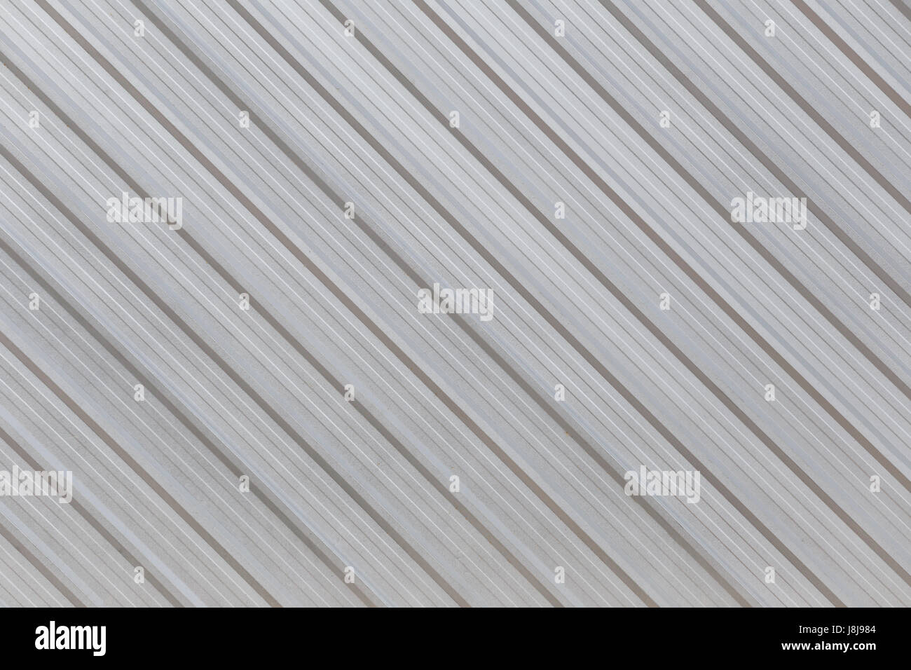 La superficie di alluminio parete argento di fabbrica per la progettazione dello sfondo. Foto Stock