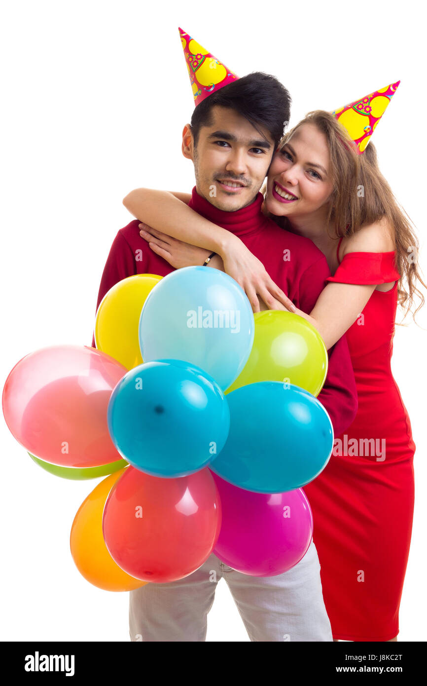 Coppia giovane con palloncini Foto Stock