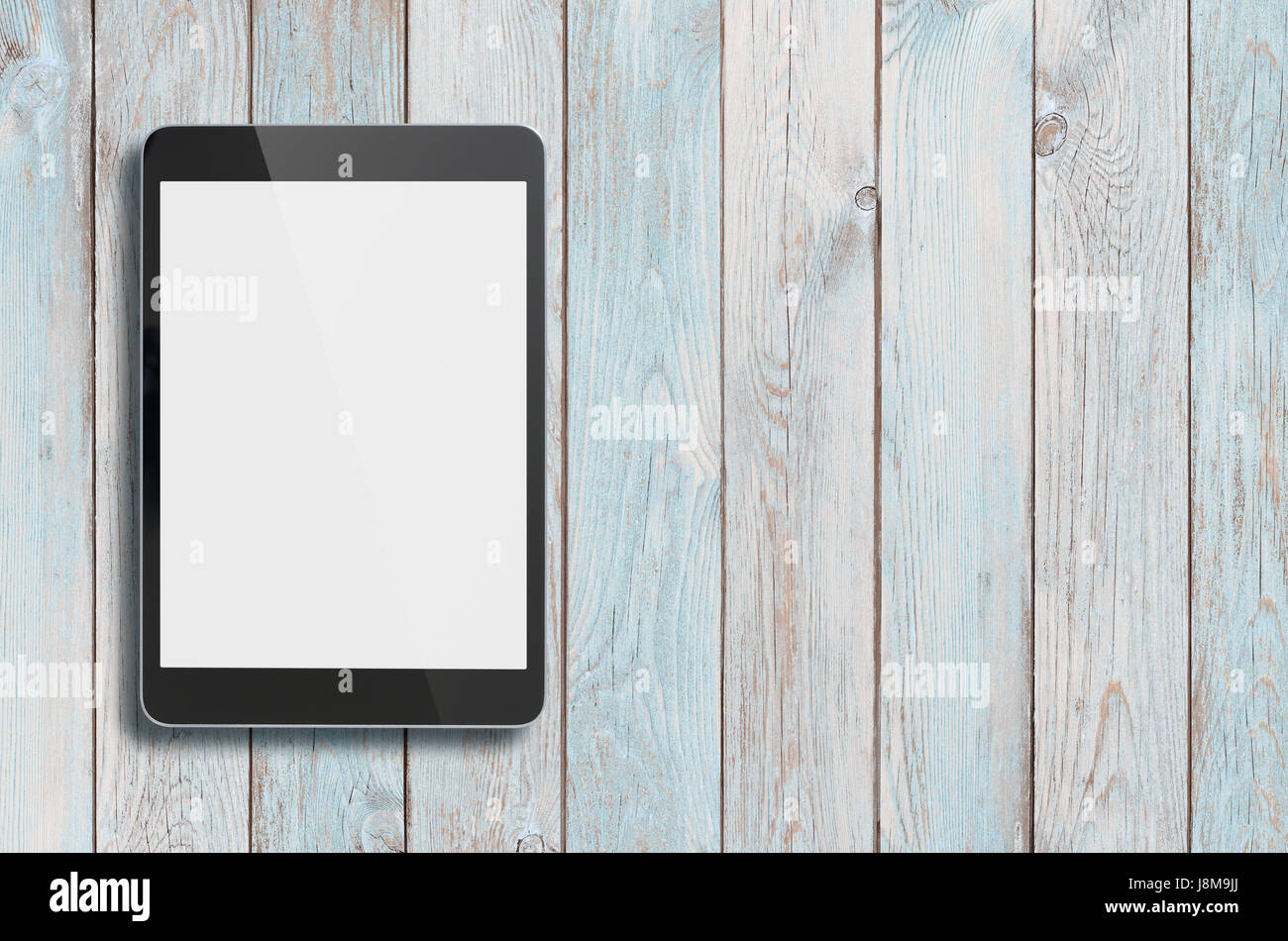 Nero tablet pc su legno vecchio sfondo tabella Foto Stock