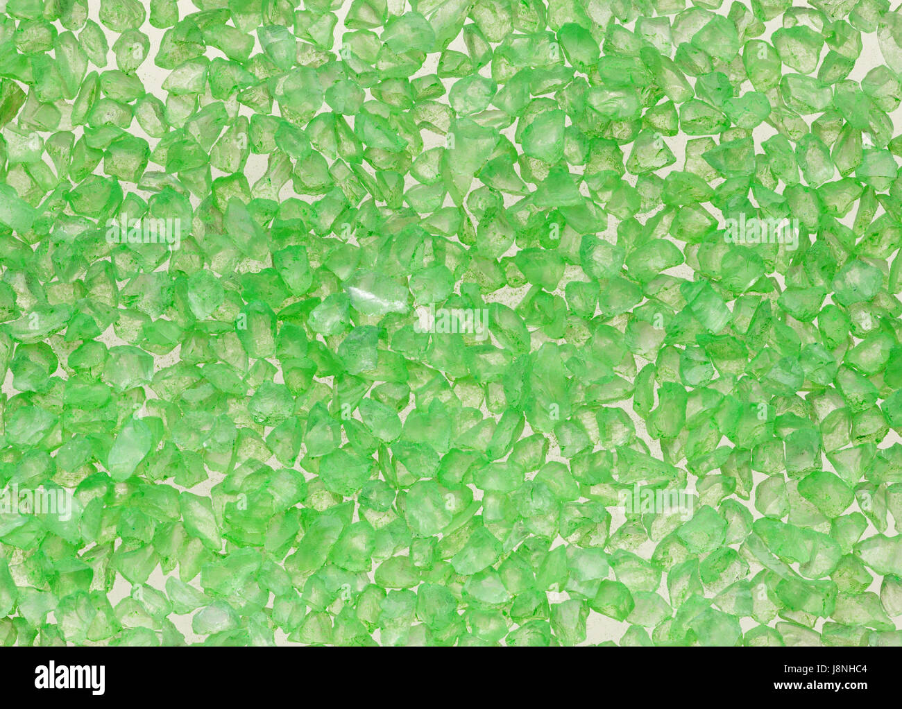 Macro sfondo dal verde traslucido cristalli. Texture di piccole pietre. Foto Stock