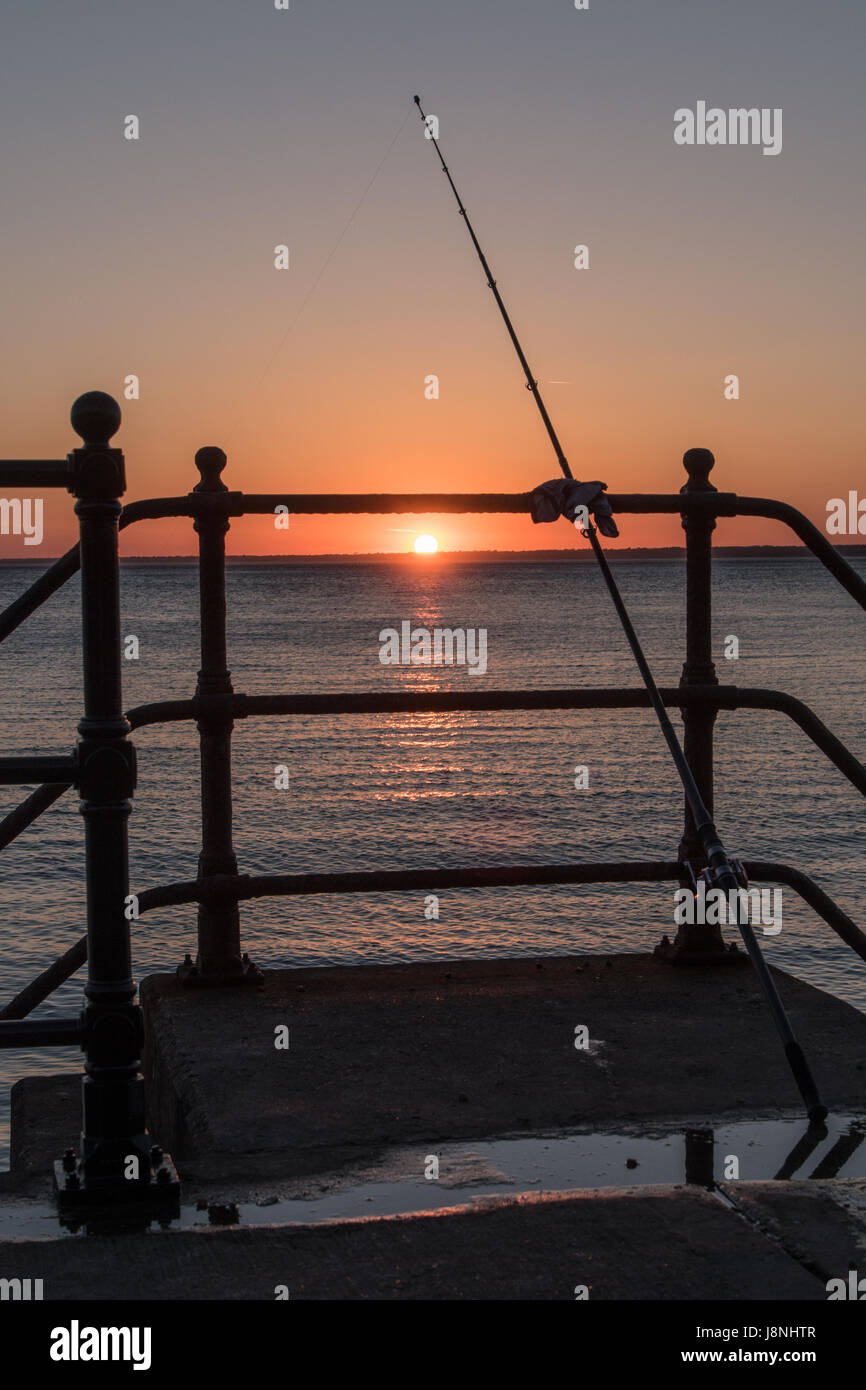 La pesca al tramonto Foto Stock