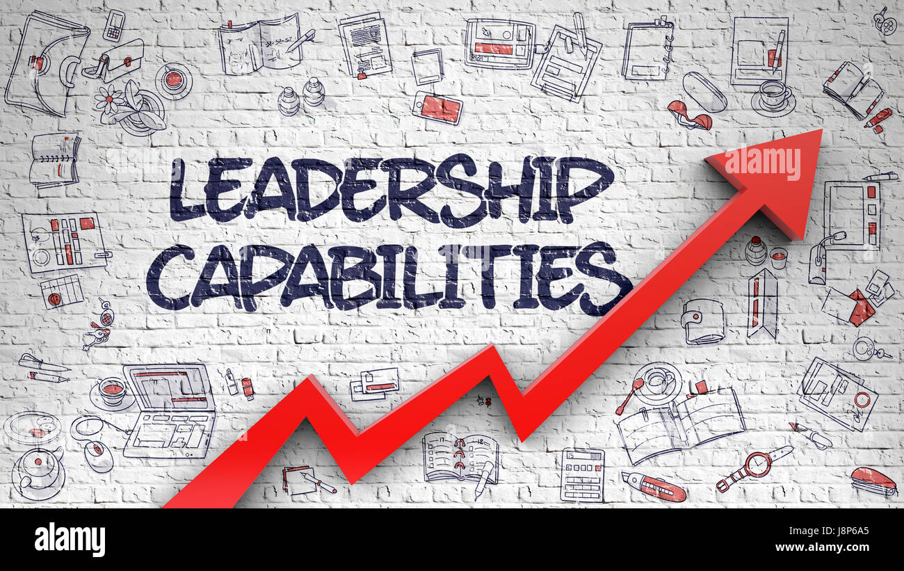 Le capacità di leadership disegnato su Brickwall bianco. Foto Stock