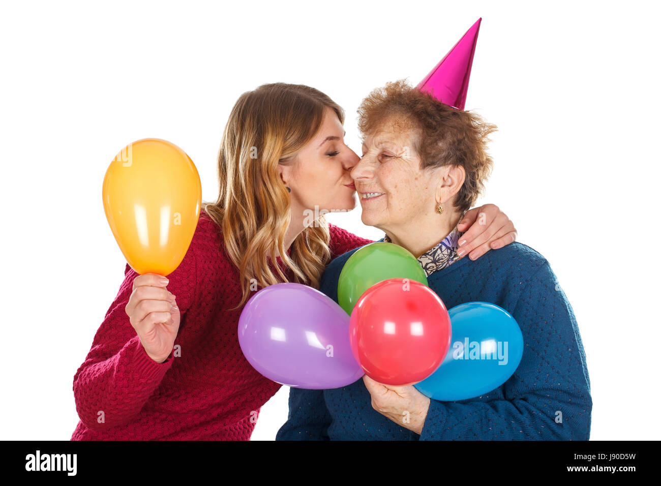 Immagine di una donna eldery festeggia il compleanno con il suo nipote Foto Stock