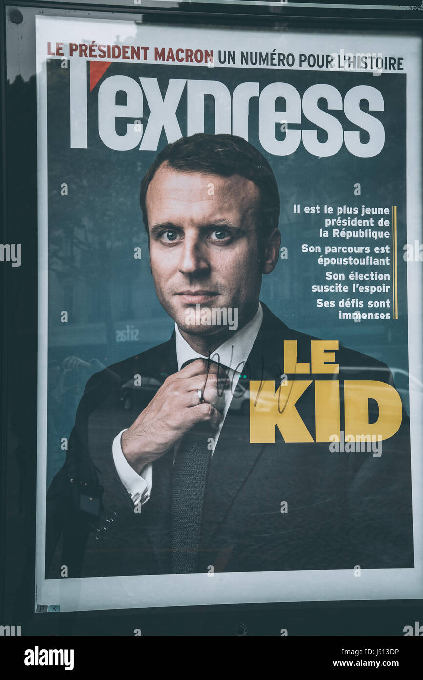 La copertina del giornale francese l'express, con Emmanuel Macron featured il giorno dopo le elezioni francesi, in corrispondenza di una edicola a Parigi. Foto Stock