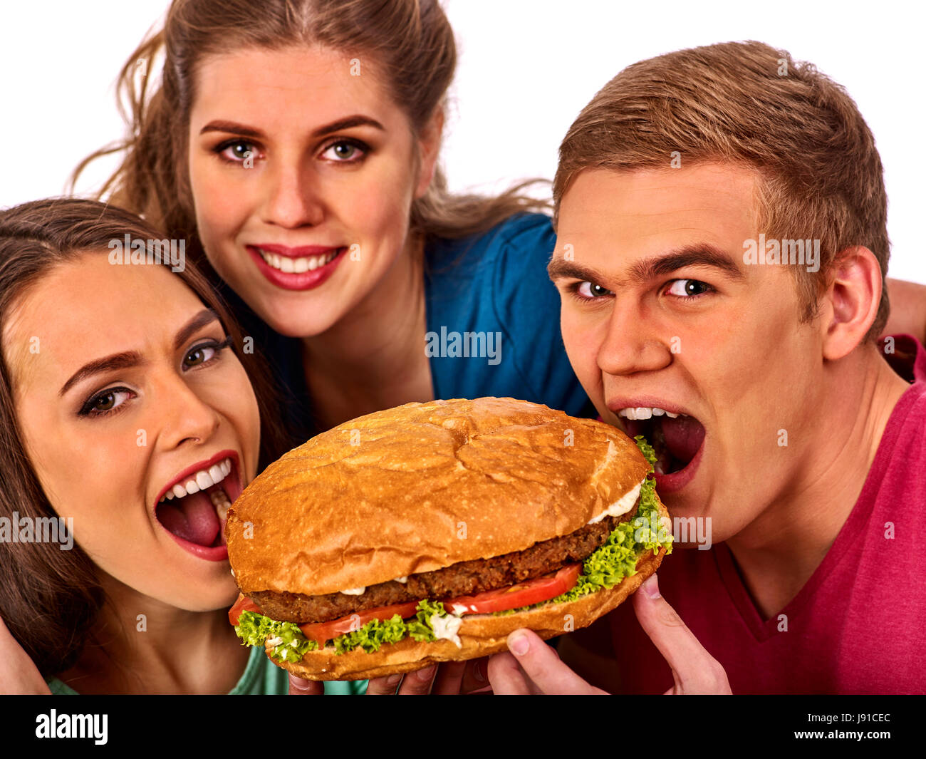 Hamburger fast food nelle persone amici mani . Foto Stock