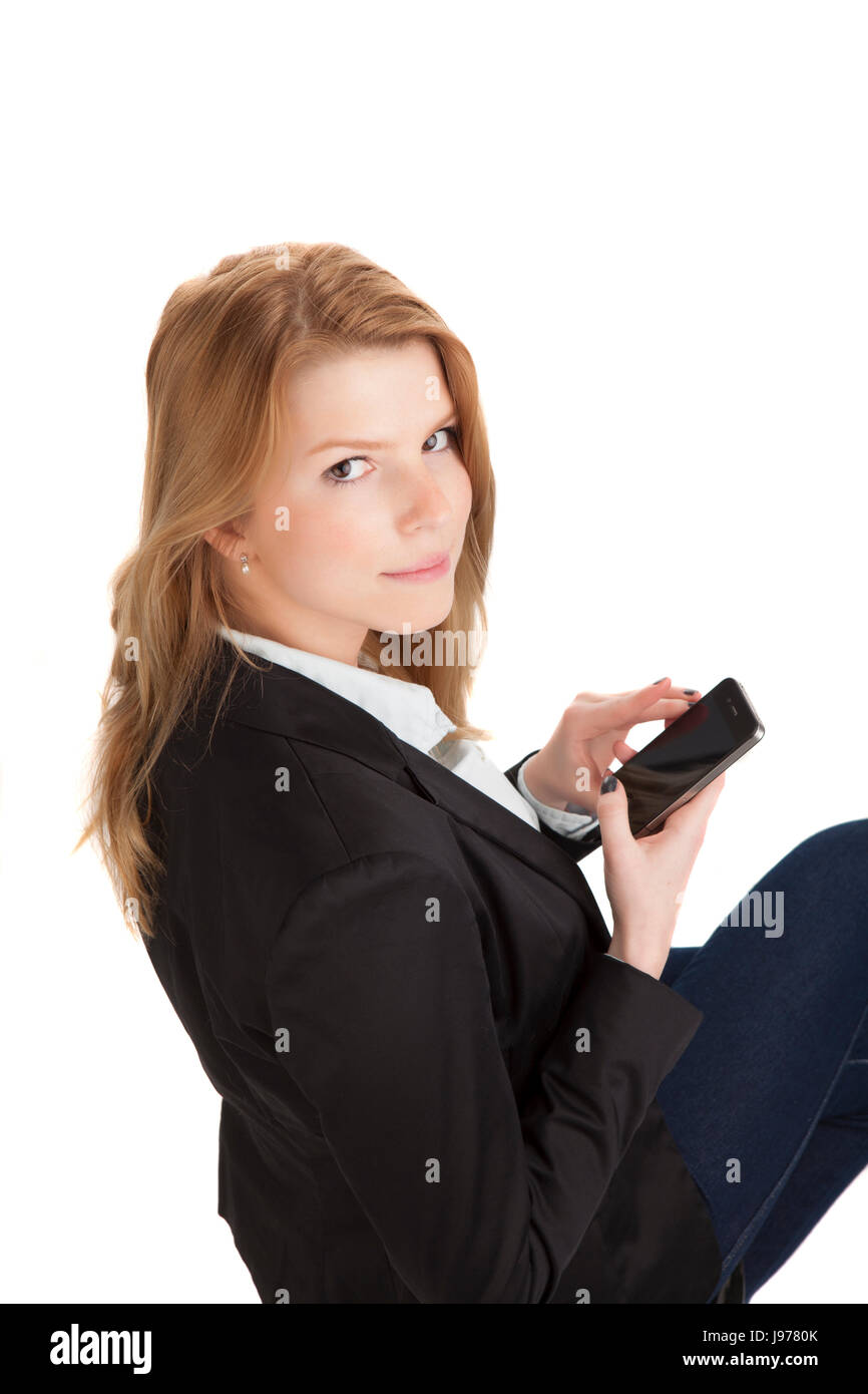 Giovane donna bionda business guarda con lo smartphone Foto Stock