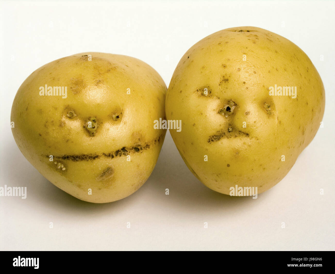 Facce di patate Foto Stock