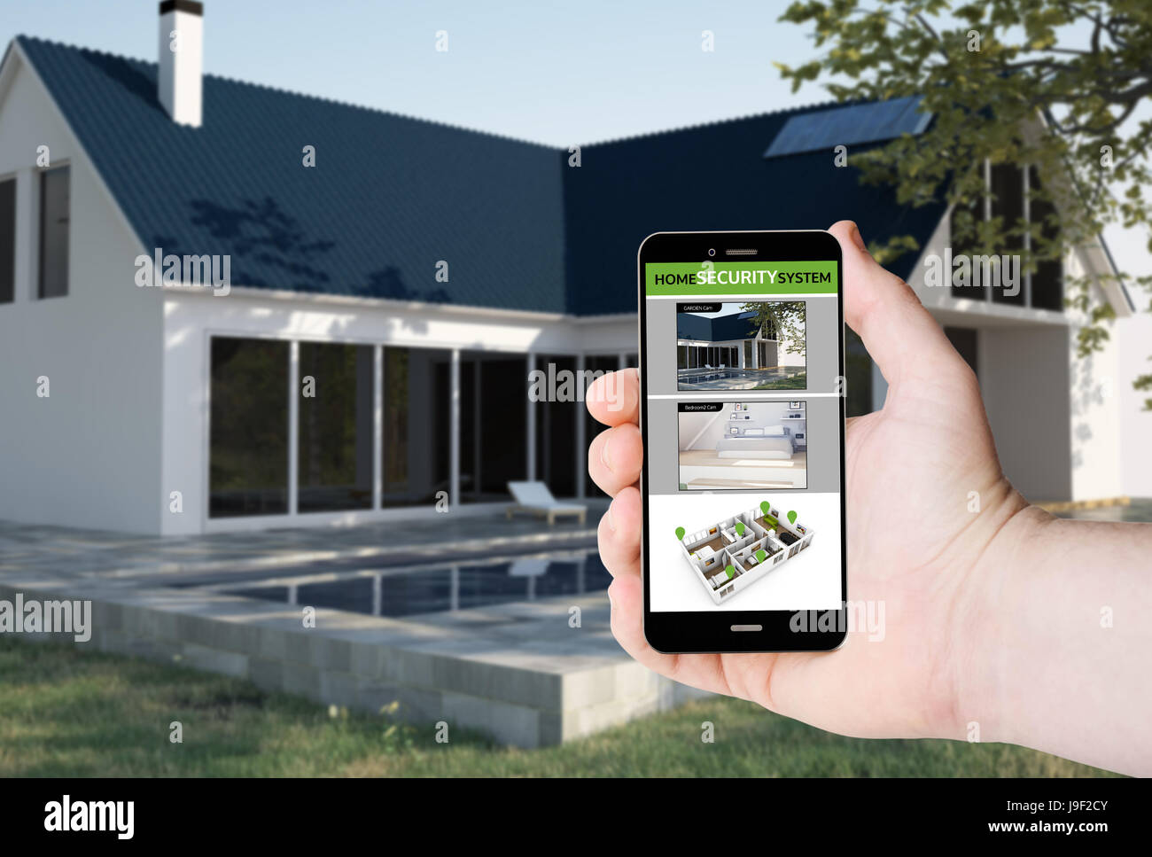 Tenere in mano un telefono con le telecamere di sicurezza di app di controllo su uno schermo sullo sfondo di una casa. Tutti i grafici dello schermo sono costituiti. Foto Stock