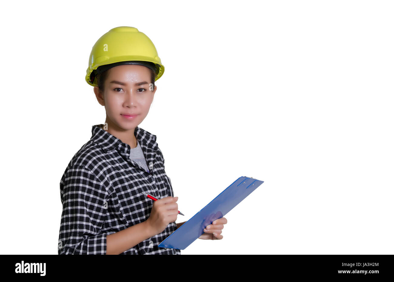 Donne asiatiche gli ingegneri e i tecnici stanno controllando la lista sulla scheda Foto Stock