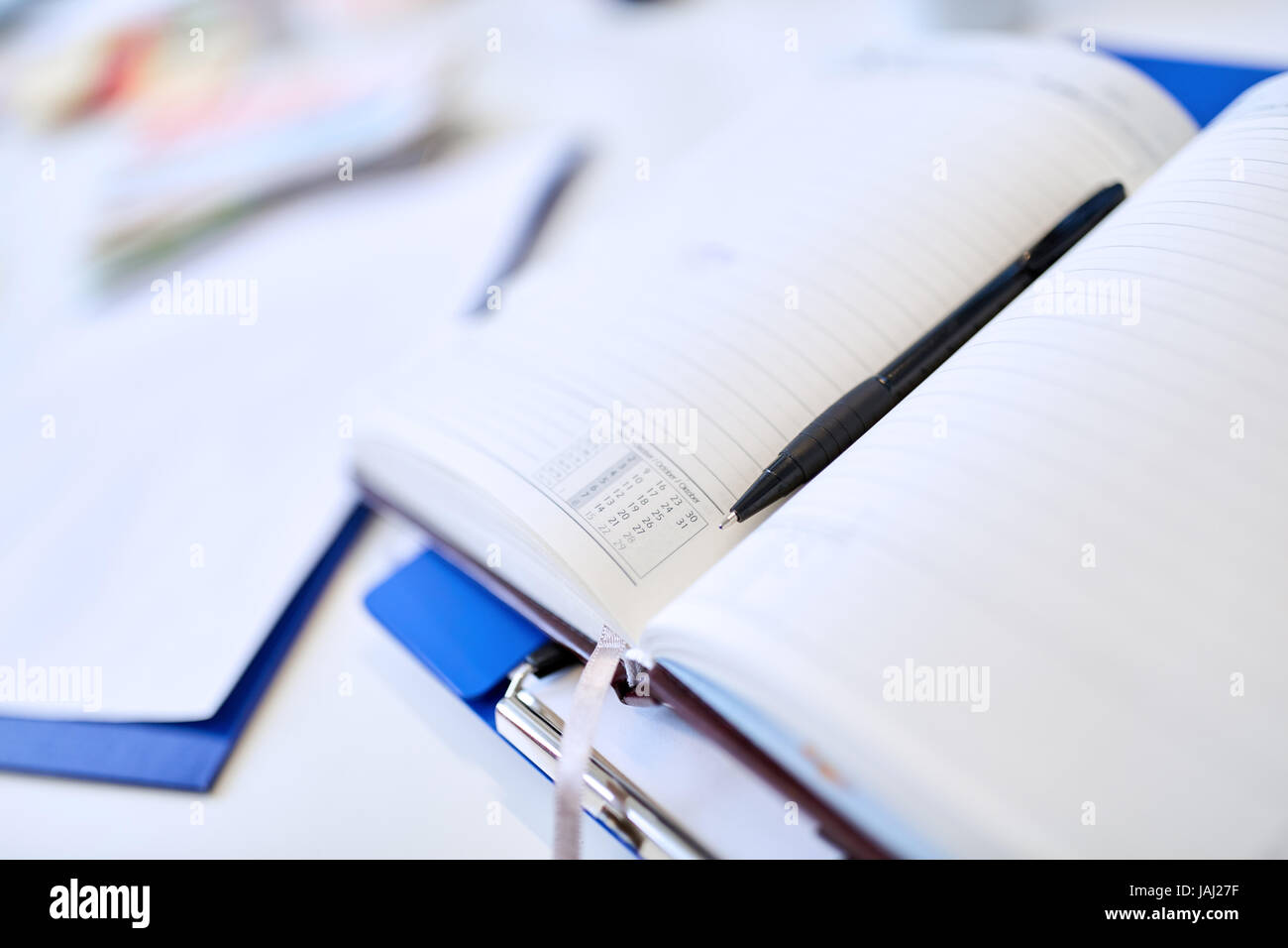 Notebook come personal organizer Calendario o con la penna per il business di tempo di pianificazione di pianificazione Foto Stock