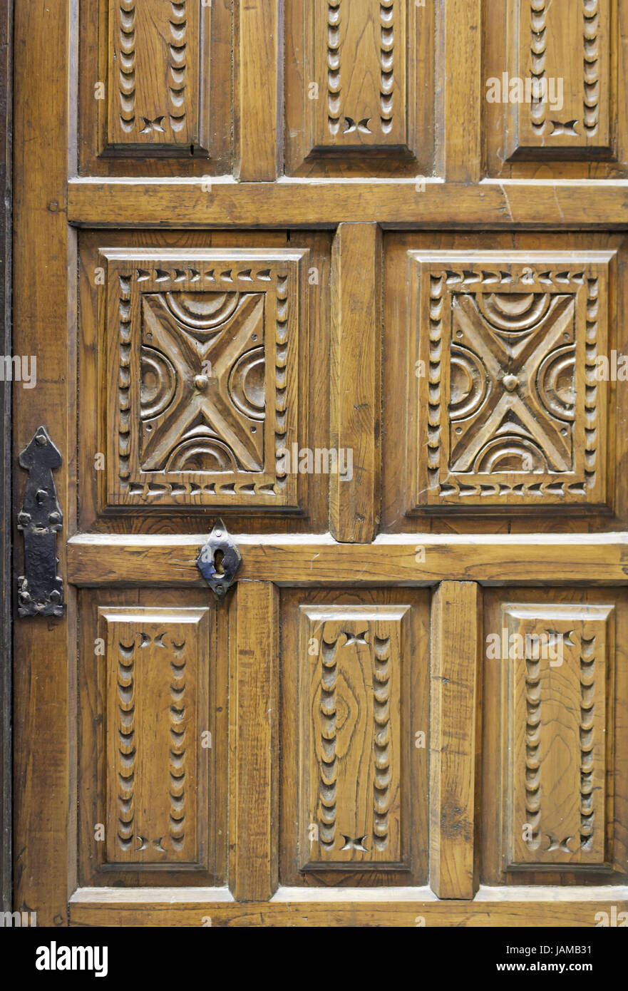 Scolpita in legno porta con il simbolo, edilizia ed architettura Foto Stock