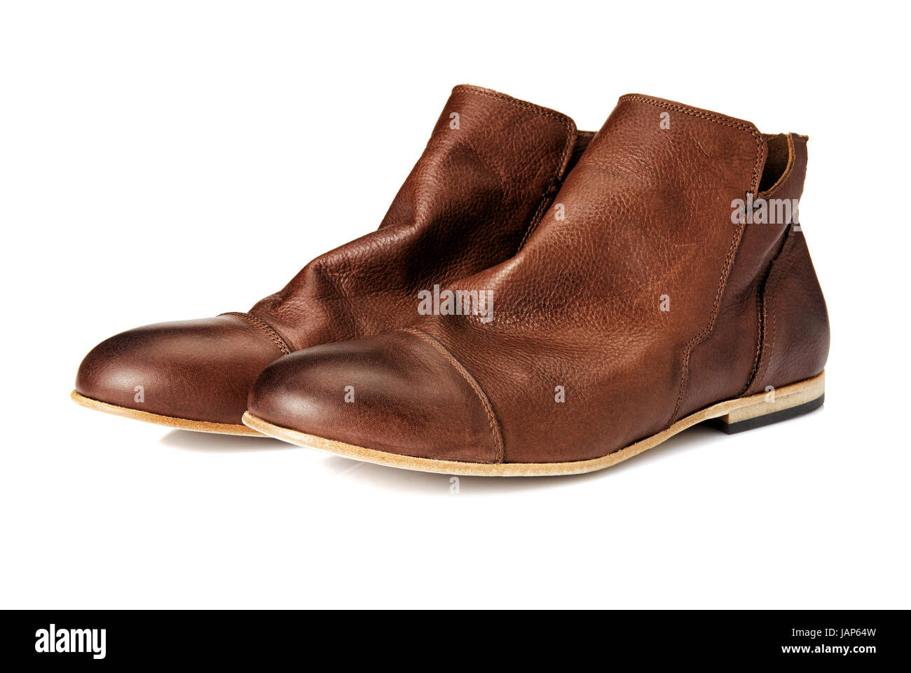 Un paio di stivali marrone. Studio shot di scarpe di cuoio. Foto Stock