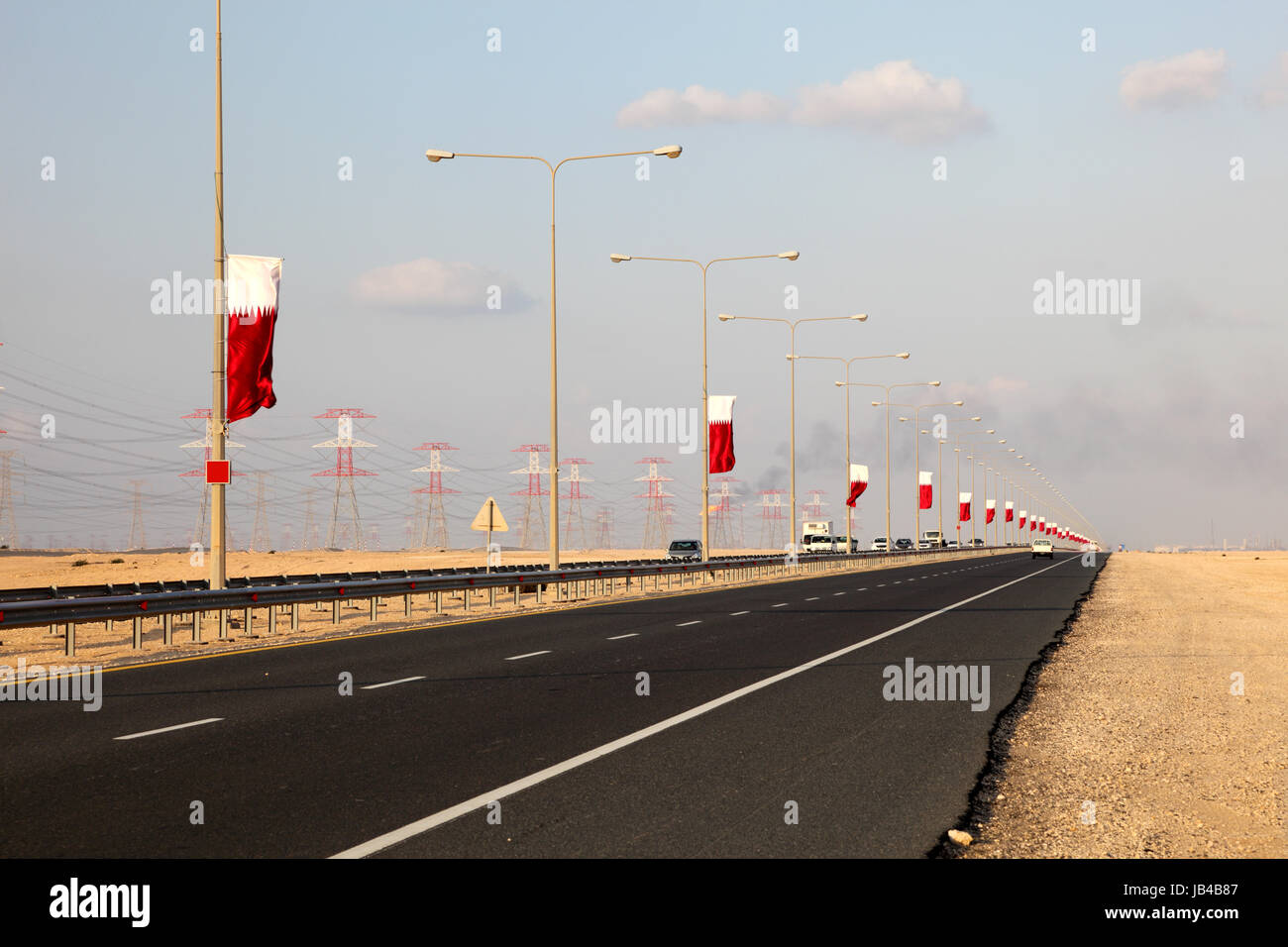 Ras Laffan città industriale in autostrada in Qatar, Medio Oriente Foto Stock