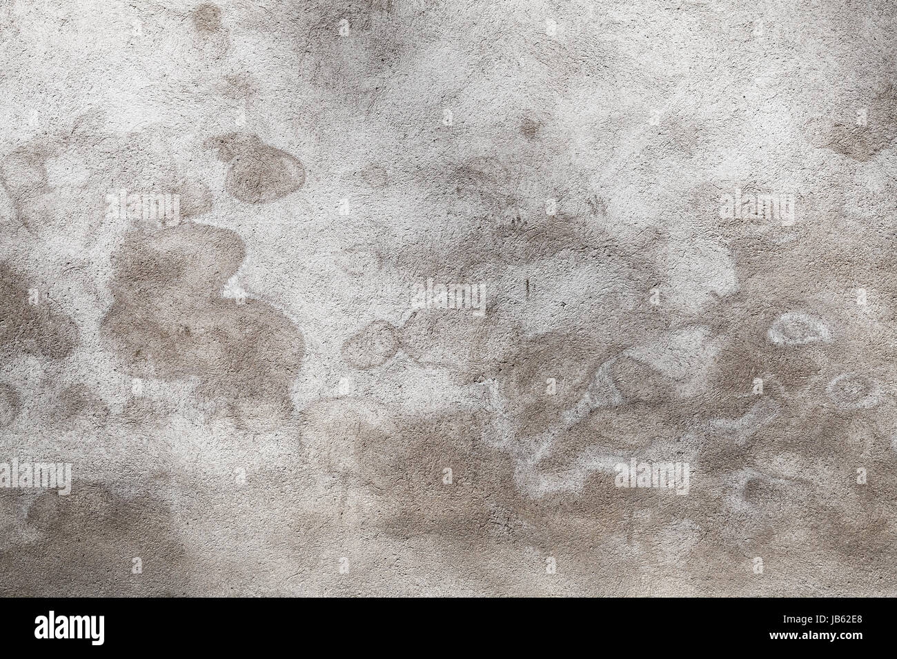 Grigio muro di cemento con macchie di umido pattern, grungy foto di sfondo texture Foto Stock