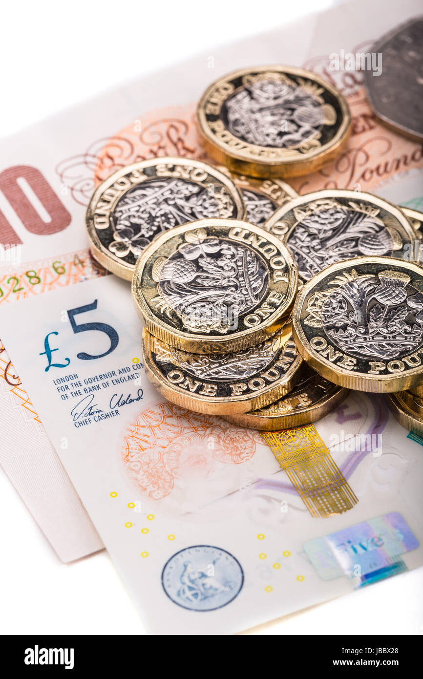 British una libbra di monete su British banconote Foto Stock