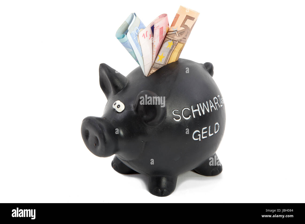 Schwarzes Sparschhwein mit dem Aufdruck Schwarzgeld, sowie einigen Geldscheinen im Schlitz. Foto Stock
