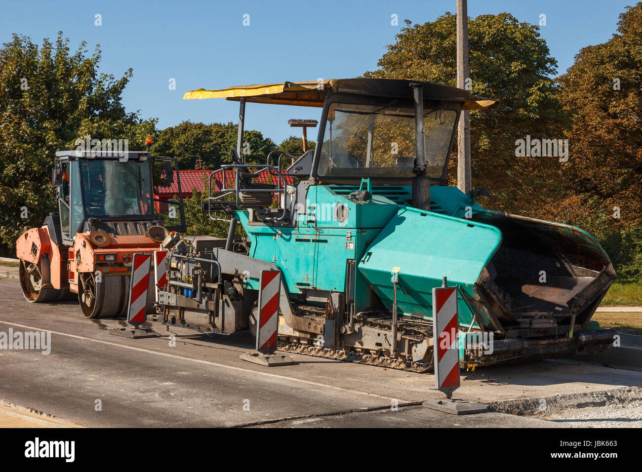 Un paio di asfaltatura macchine non funzionante Foto Stock