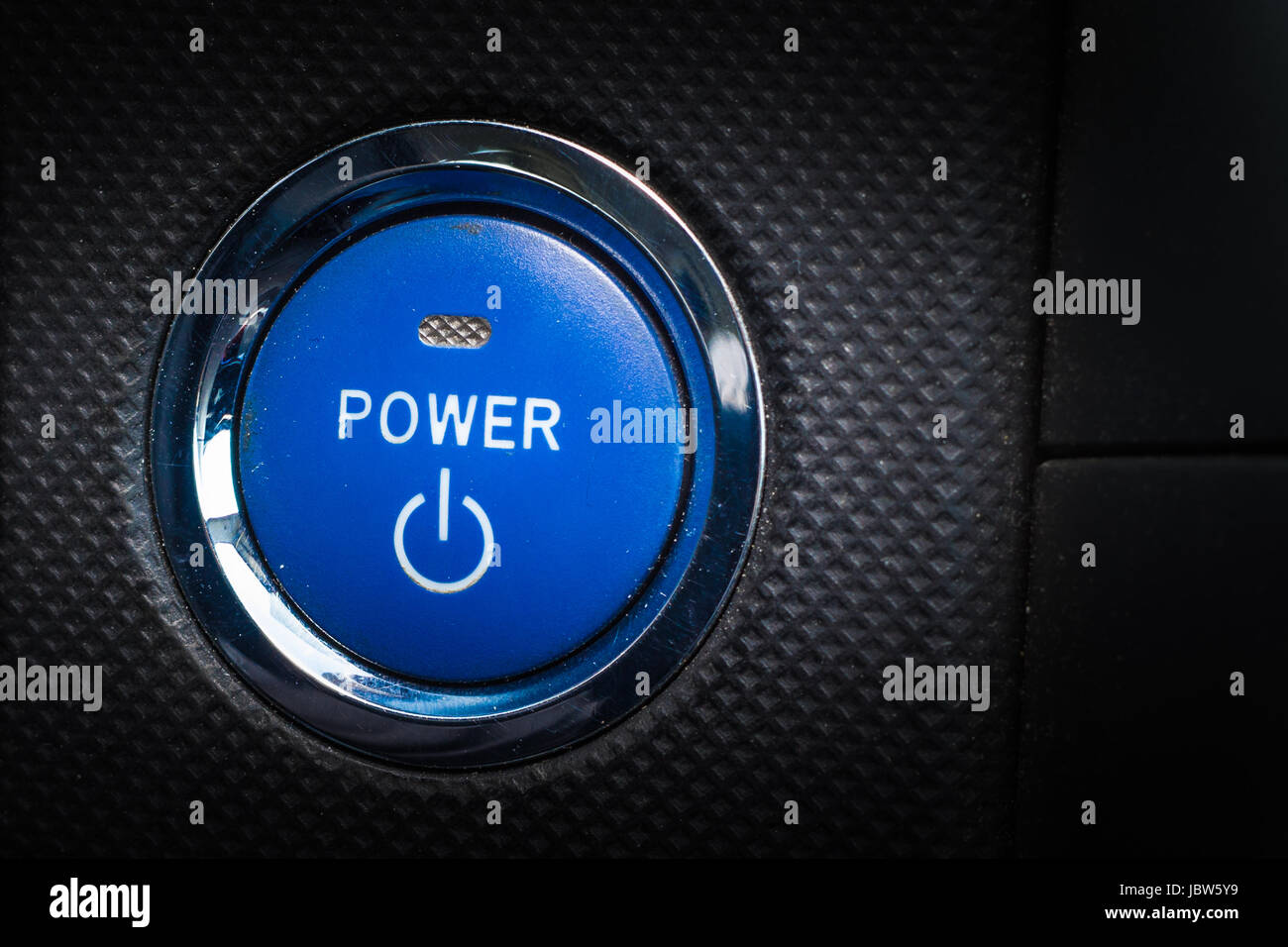 Hybrid auto blue start pulsante motore. Lo sfondo del settore automobilistico Foto Stock