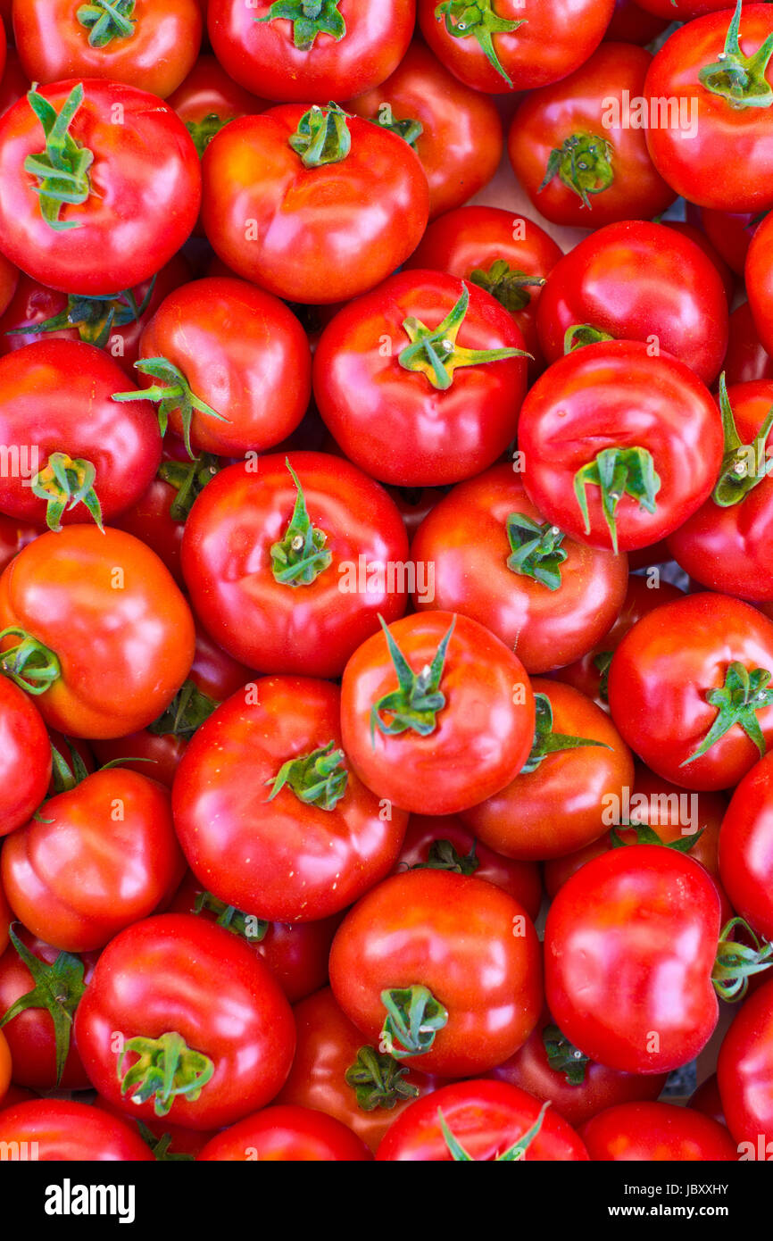 Reife rote Tomaten als Hintergrund Foto Stock