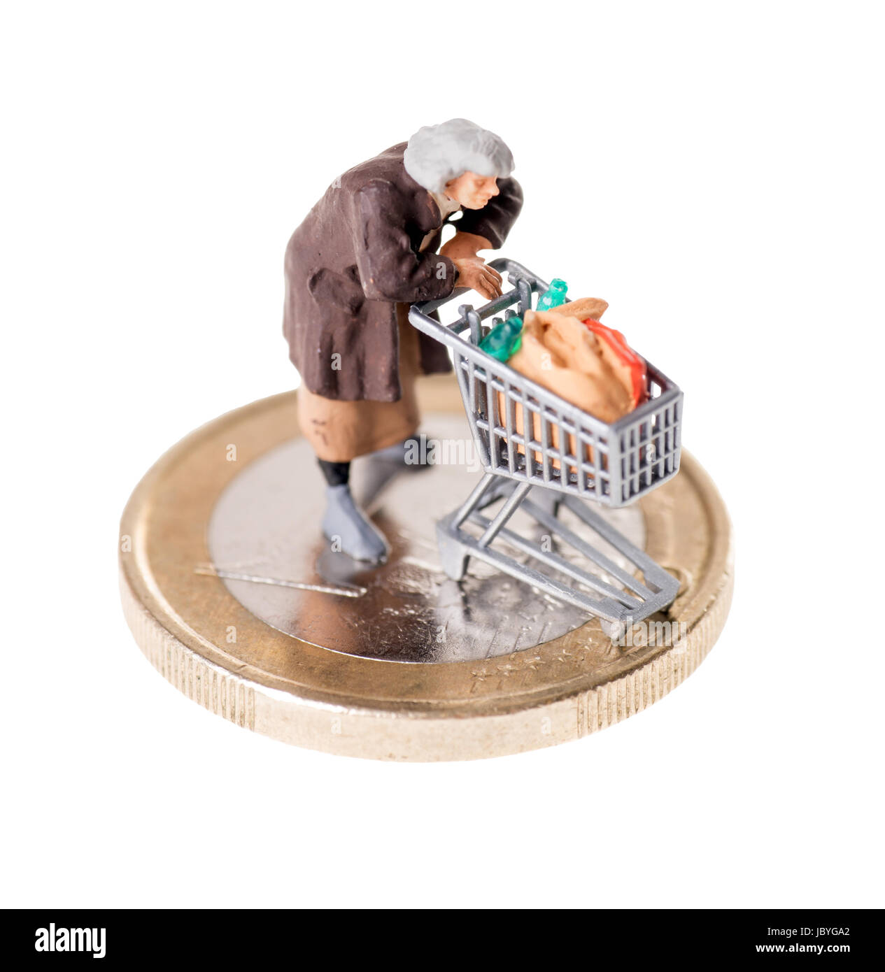 Vecchia donna con carrello su una moneta Foto Stock