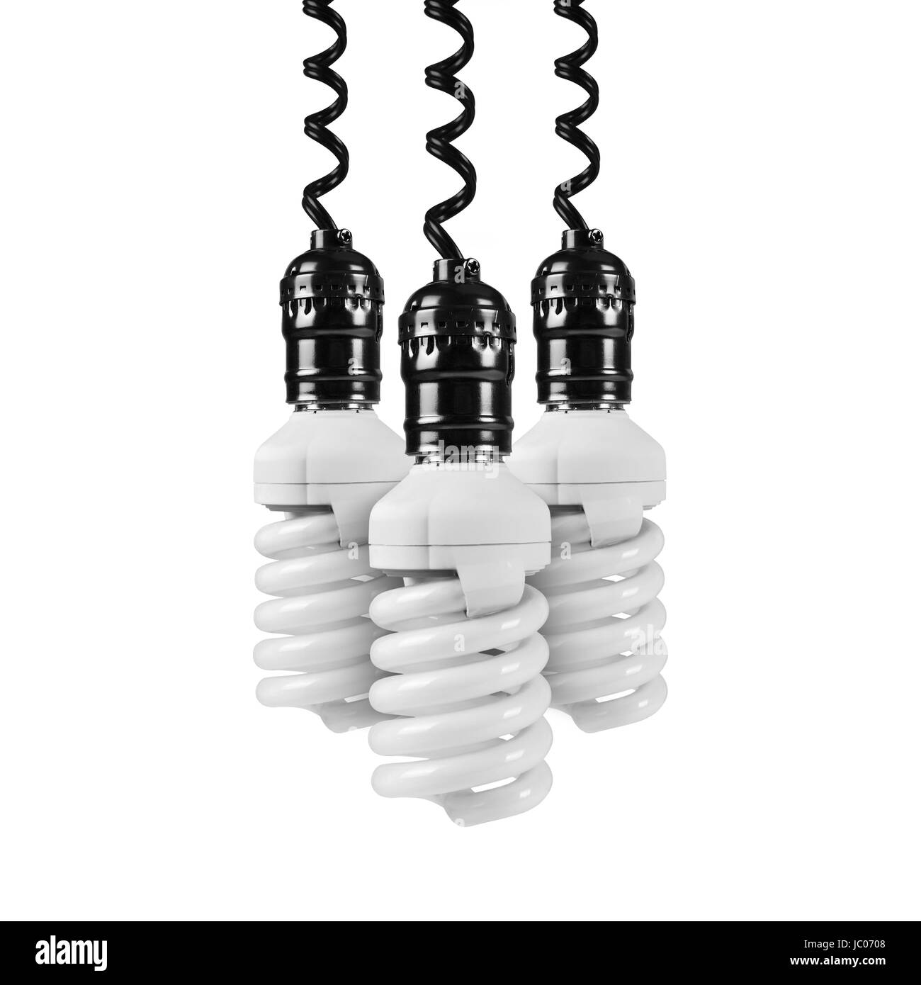 Tre risparmio energetico lampada pende verso il basso sulla parte superiore su uno sfondo bianco. Foto Stock