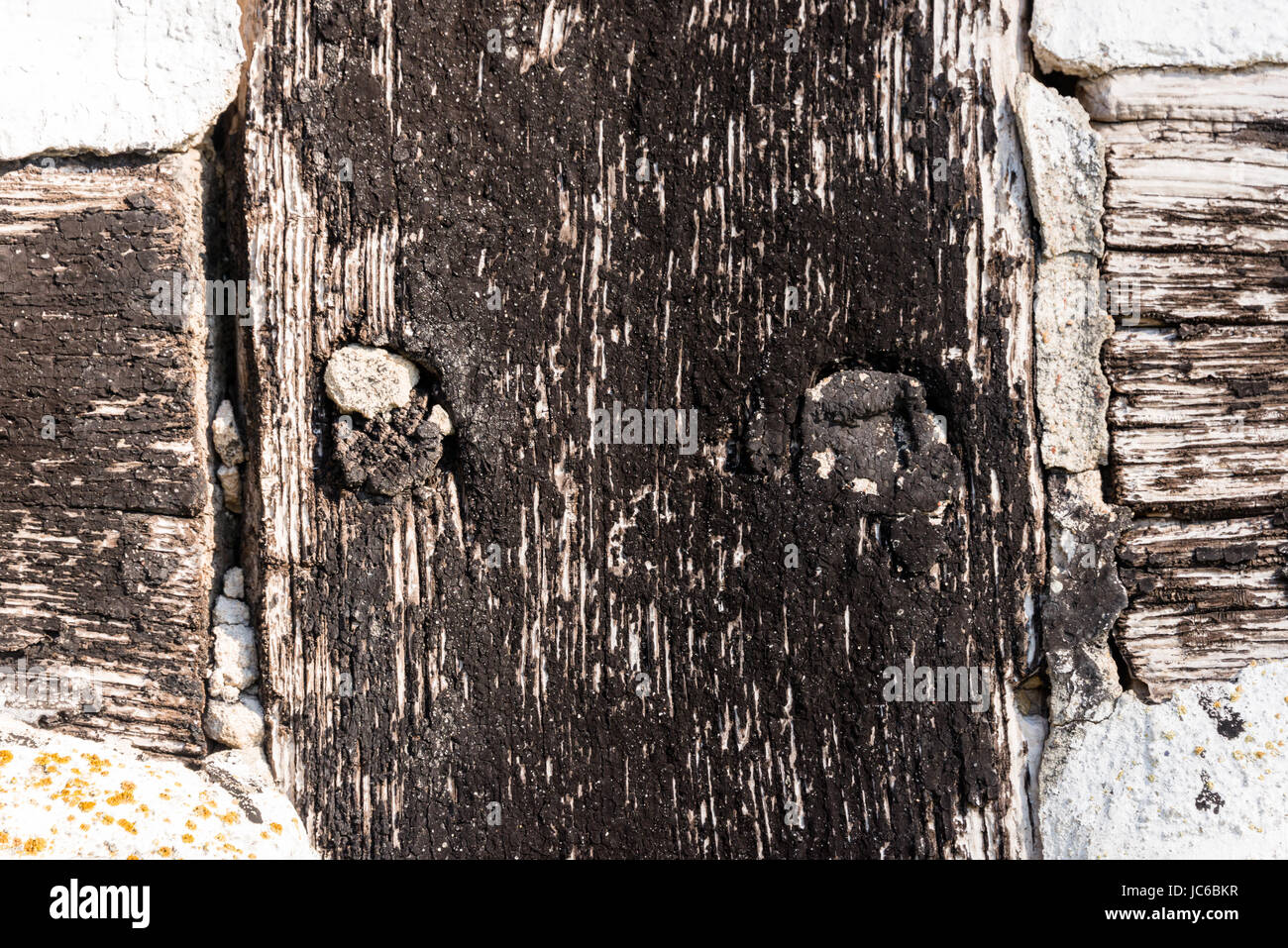 Close up di criss-cross a struttura mista in legno e muratura frame-lavoro - per scopi di sfondo Foto Stock