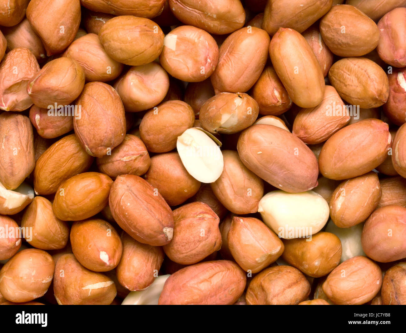 Close up di materie non cotti arachidi sfondo alimentare Foto Stock