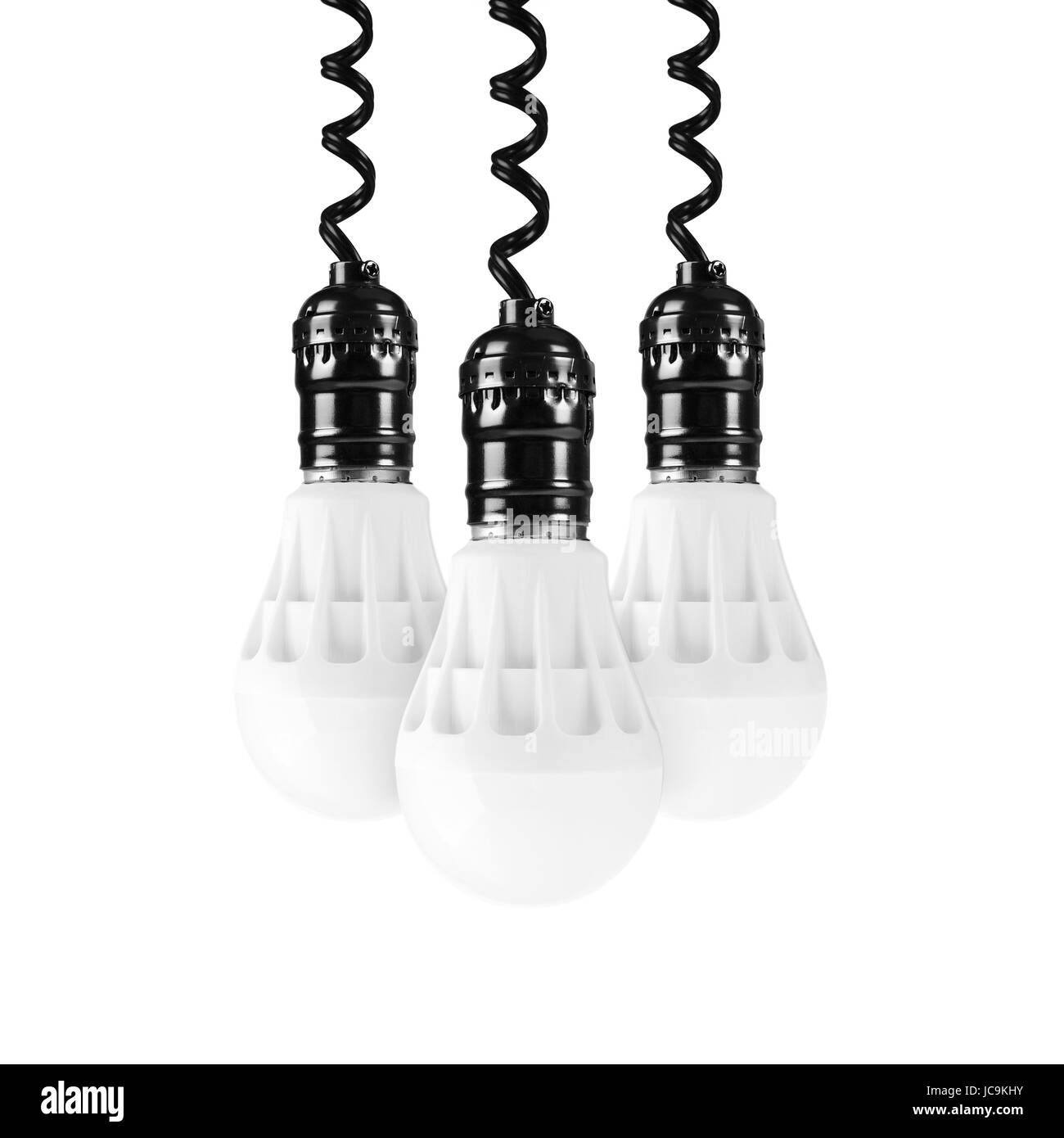 Tre lampadine a LED pende verso il basso sulla parte superiore su uno sfondo bianco. Foto Stock