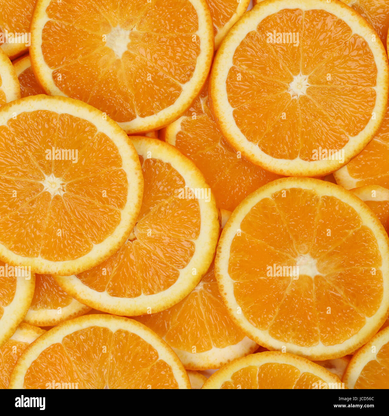 Hintergrund aus geschnittenen Orangen Scheiben Früchten Foto Stock