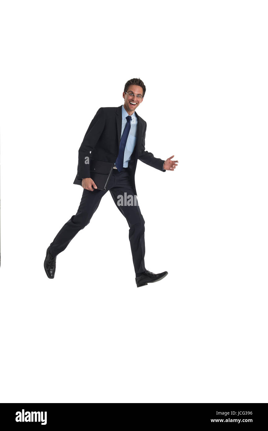 Geschäftsmann mit Aktentasche springt Foto Stock