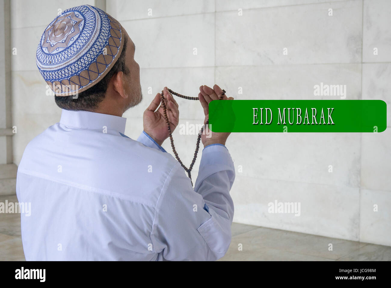 EID MUBARAK concetti word con lo sfondo del modello musulmano. Foto Stock