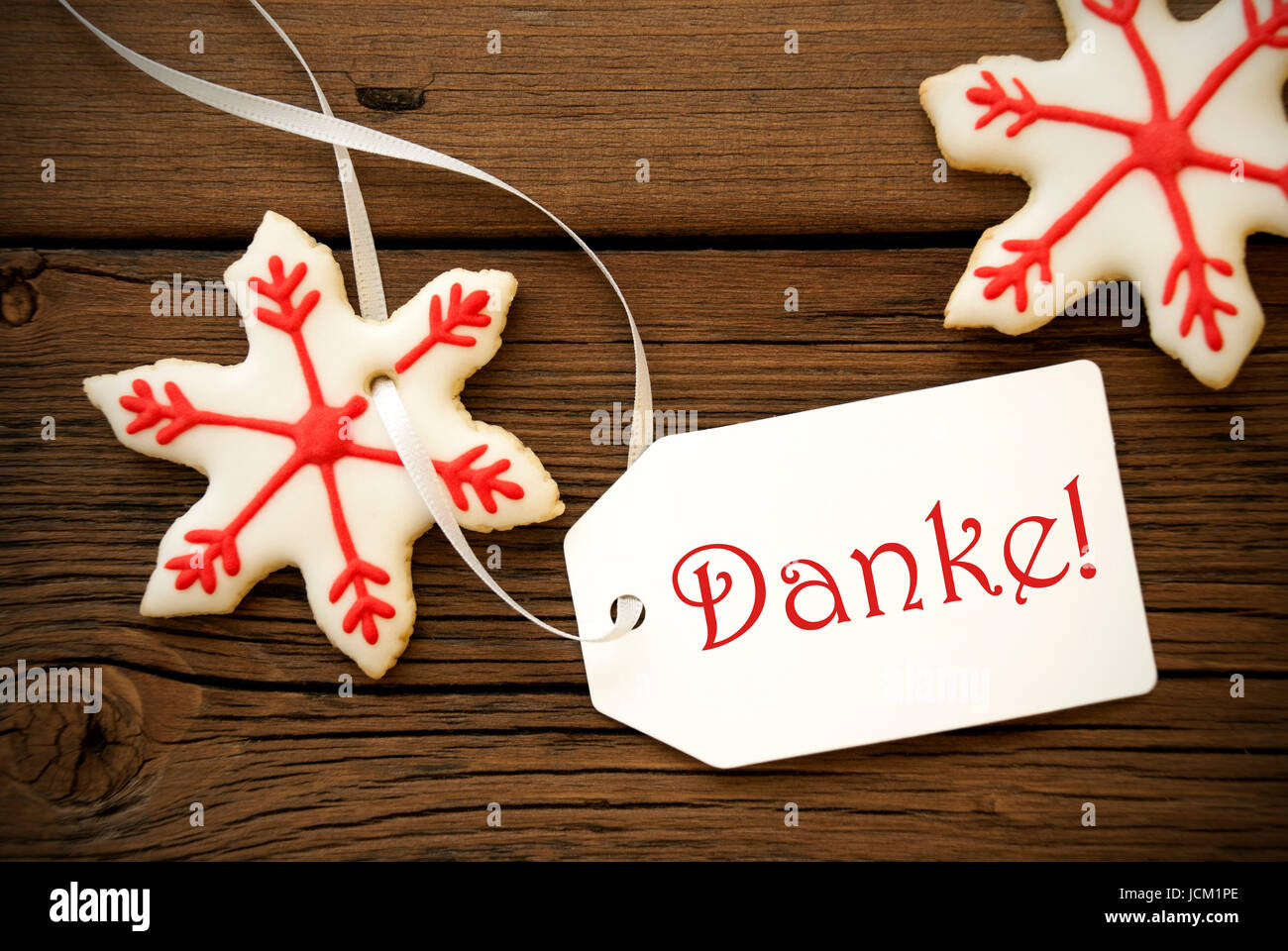 La Parola Natale Significa.Rosso E Bianco Stella Di Natale I Biscotti Con La Parola Tedesca Danke Che Significa Grazie Foto Stock Alamy